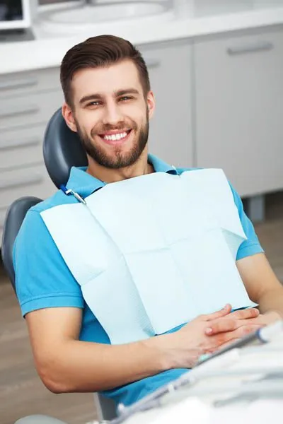 man sitting in the dental chair at Rugby Dental Arts in Charlottesville, VA
