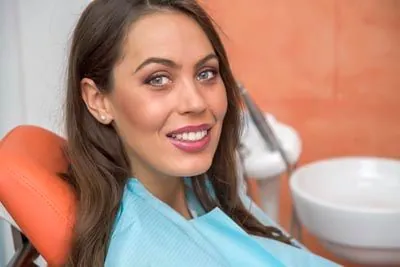 woman smiling during her visit to Rugby Dental Arts in Charlottesville, VA